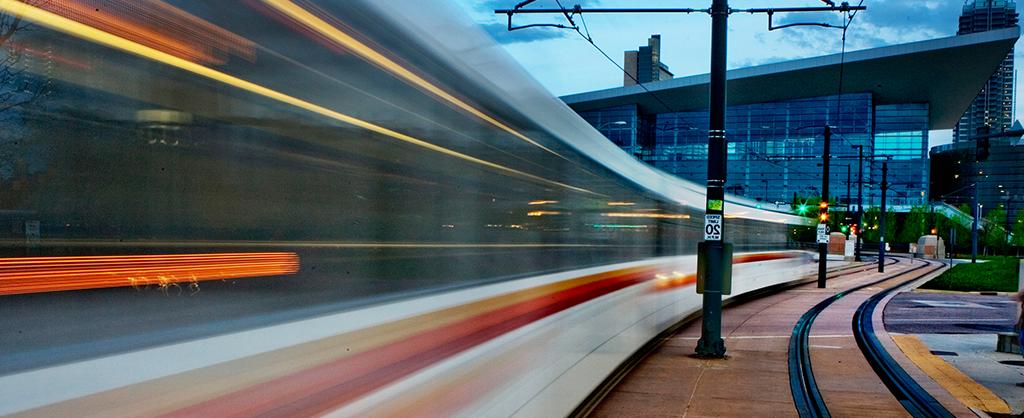 RTD Light Rail train speeding through downtown Denver.